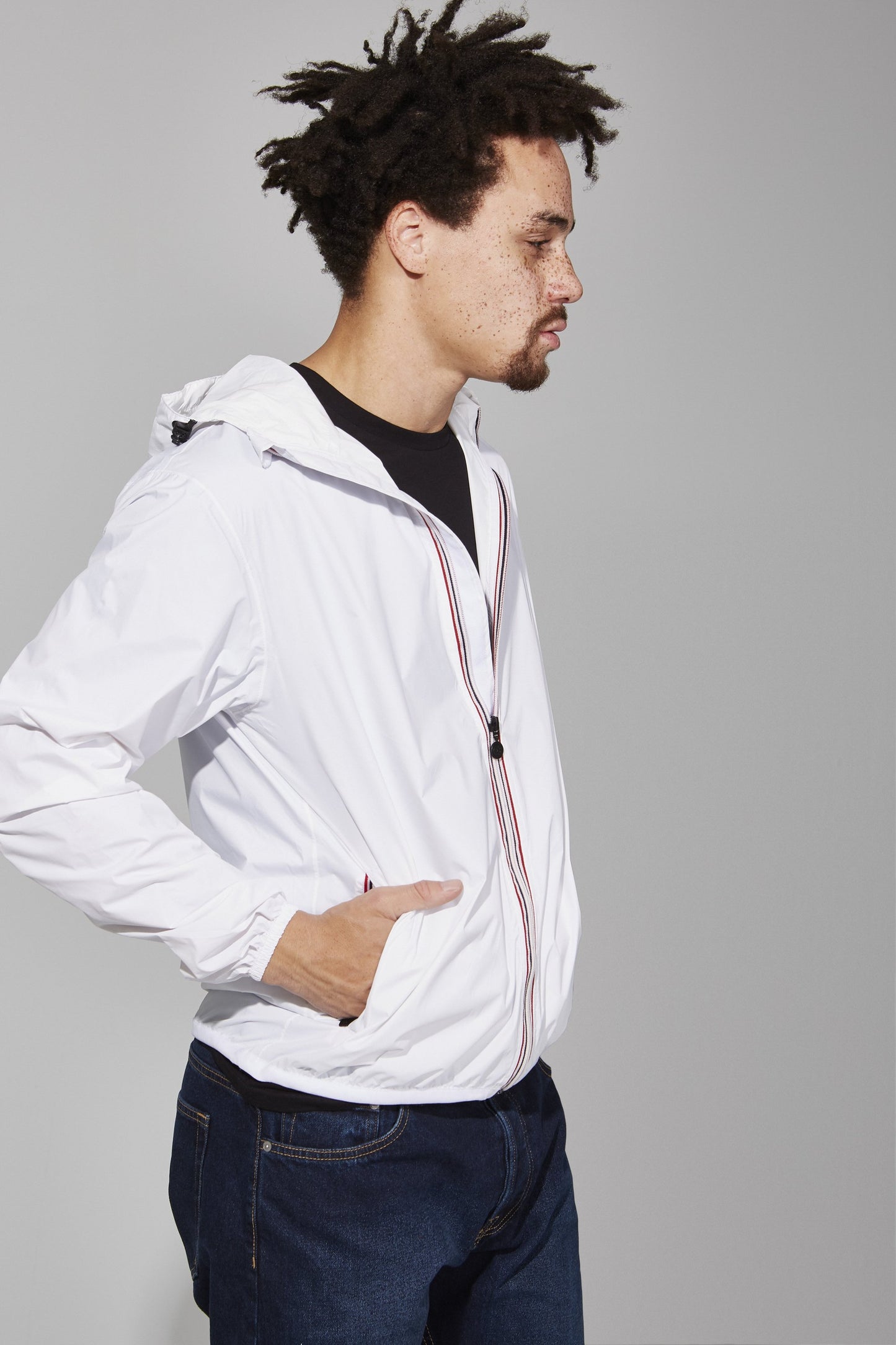 White full zip packable rain jacket and windbreaker