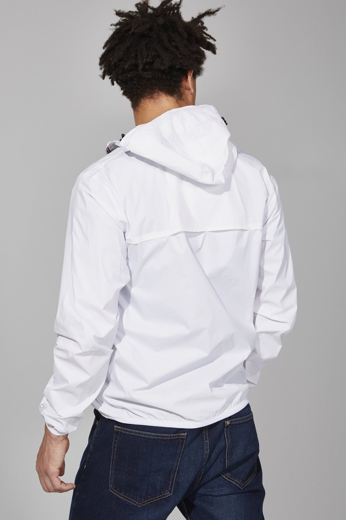 White full zip packable rain jacket and windbreaker